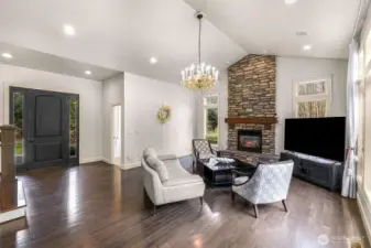 Living room with powder room next to front door