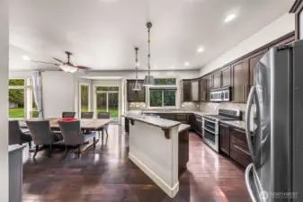 Kitchen looking toward dining area and backyard views