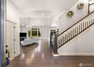 Grand entryway with staircase and open floor plan