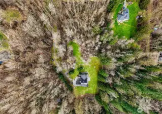Aerial view showing the property surrounded by trees and privacy