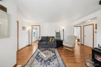 The family room is centrally located in the heart of the home between the two bedrooms & bathroom.