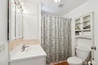 Full bathroom located centrally between the two bedrooms on the main floor.