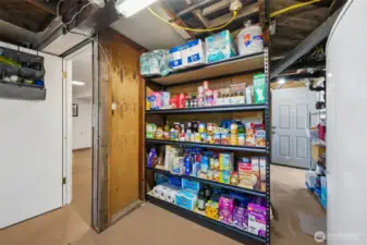Storage options are not short in this home- part of the unfinished basement makes room for a great pantry area.