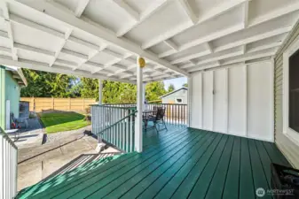 Nice large covered deck overlooking the backyard and can still see the kids on the playground.