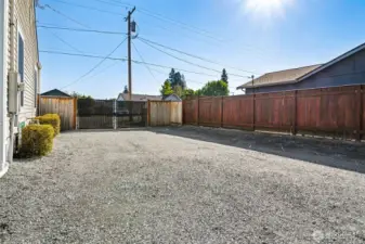 Large double gate on side of home to access backyard, parking, shop & room to bring in trailer!