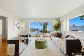 Cozy living room with fireplace and view.