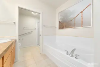 Primary jetted tub and double headed walk in shower
