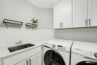 Laundry Room was updated with new cabinets and countertops along with Kitchen