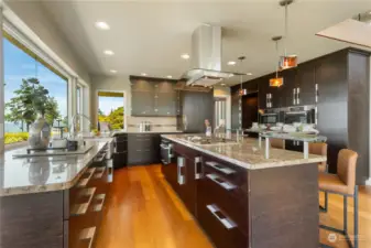 Kitchen that includes sweeping views, granite counters, Miele appliances, custom cabinets with soft close doors a drawers.