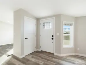 Front entry with closet.