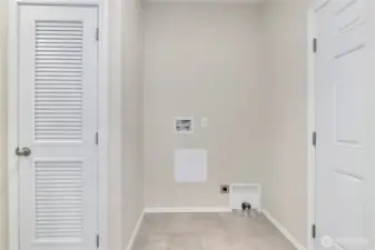 Laundry room with door to back yard.