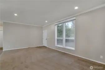 Flooded with natural light from the oversized windows.