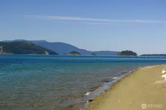 Shared beach access.    One of two beach access points.  Cypress Island     campgrounds just across the channel.