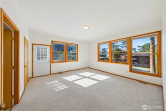 Primary bedroom has en-suite bath and door outside to private deck & back yard.