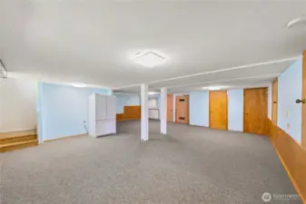 Spacious lower level has fridge, coffee bar, entry to outside under deck.