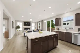 Large open concept great room and kitchen with large island with breakfast bar.