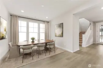 Open concept formal dining room. Virtual staging in photo.