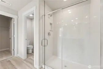 5-piece primary bathroom includes step-in shower, double vanity, and freestanding bathtub.