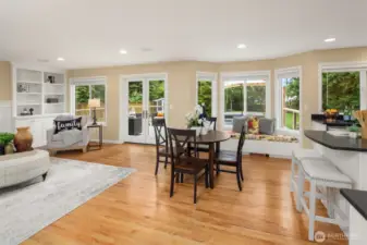 Gleaming hardwood floors throughout the entire main floor.  Wall of windows, stretching from family room to kitchen showcasing breathtaking views of the gorgeous backyard.