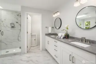 Spa-like Primary en-suite bathroom boasts walk in shower, soaking tub, private toilet, and walk in closet.