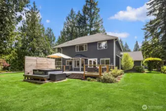Looking back at the house, perfectly sited on the lot, with space on both sides, and an ample front yard but with a vast back yard, giving loads of privacy.