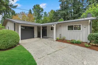 Front of the home.  Private garage parking and plenty of driveway parking as well.