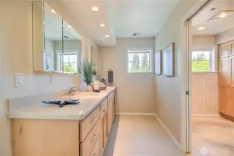 Large primary suite bath with 2 sinks, shower and private toilet room.