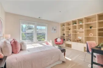 Second bedroom with craft, office and storage potential, file drawers shelves, cabinets, drawer space in this extra spacious and light filled room.