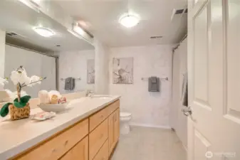 Hall bath has complete with shower tub combo.