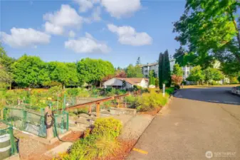 Enjoy viewing the goings on at the ever-popular Pea Patch Gardens from you primary suite deck.