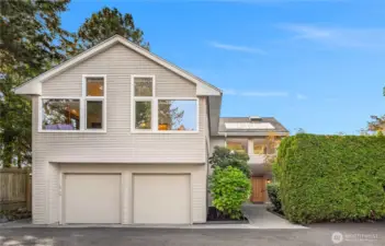 Lots of parking, circular driveway, and level entry into house.