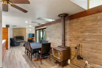 Free Standing wood stove between the dining room & music room