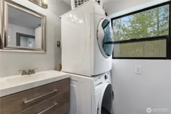 Nicely remodeled main full bath, which is also home to the laundry room