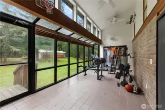 This is the sun room - home to the exercise equipment. Slider in background opens to Primary BR