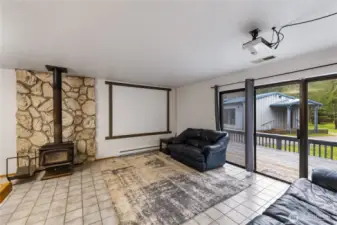 ADU - spacious living room w/ FS wood stove. Tile floor, slider to very spacious deck