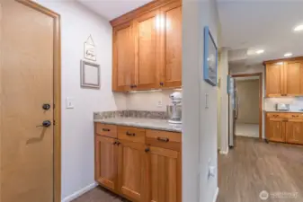 Butler's pantry off the garage entry provides additional storage and prep space