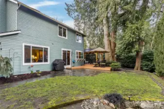 Fully-fenced yard with mature landscaping