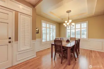 Check out the gorgeous dining room boasting coved ceiling, Plantation Blinds. Great size for family celebrations or entertaining!