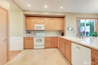 The kitchen is part of the large open area, and boasts lots of counterspace and an eating bar.