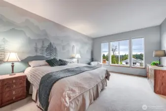 The large primary bedroom enjoys the views and boasts an ensuite 5 piece bathroom with soaking tub AND a walk-in closet.