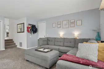 Second living area down just a few steps off the kitchen area with door access to garage