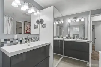 Primary bathroom with storage and 2 vanities