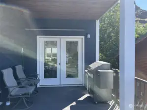 Barbeque area with french doors leading to the kitchen and dining area.