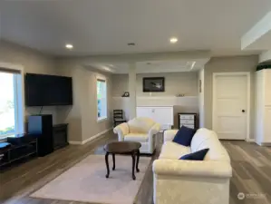 Lower basement family room with a murphy bed for your guest. Plenty of room to add another bedroom.