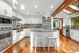 Chef’s island kitchen with Viking Professional and SubZero appliances, granite counters.
