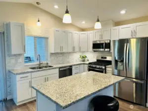 Light and bright kitchen with stainless steel appliances