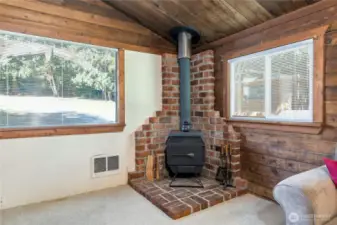 Cozy wood-burning stove. Firewood out back stays with the home!