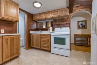 Kitchen has a restroom and more storage off to the side