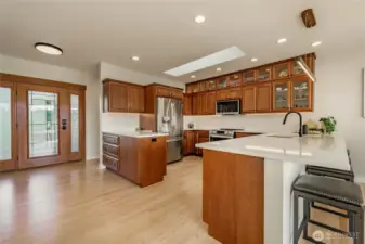 Soft white quartz countertops & mother of pearl backsplash