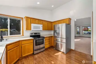 Laminate hardwood flooring in kitchen, entry way and down hall way.